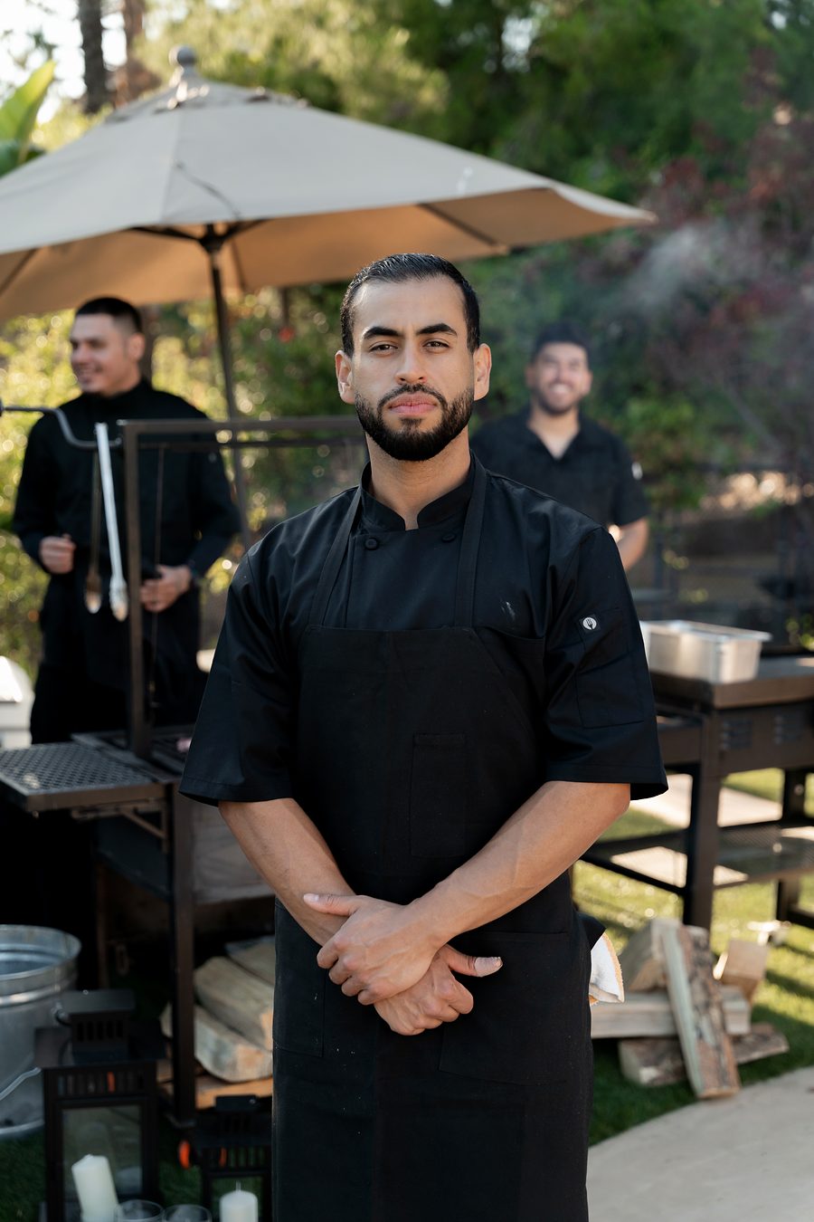 Chef Edgar Meza at his live-fire grill station