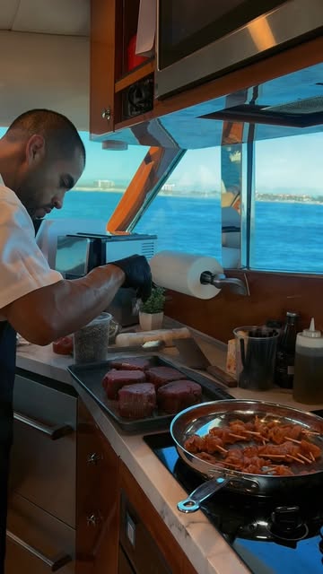 Edgar cooking aboard a yacht