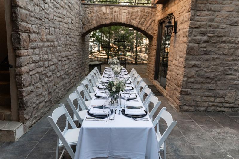 Courtyard dinner table set for the evening