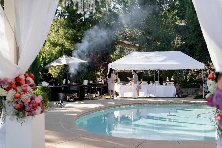 Smoke from the grill drifting over the pool